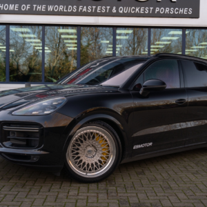 Black Porsche Panamera parked in front of ESMotor building.