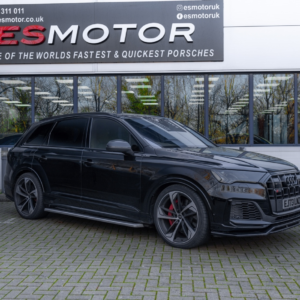 Black Audi RSQ8 parked in front of ESMotor building.