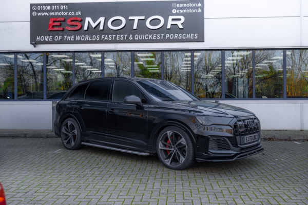 Black Audi RSQ8 parked in front of ESMotor building.