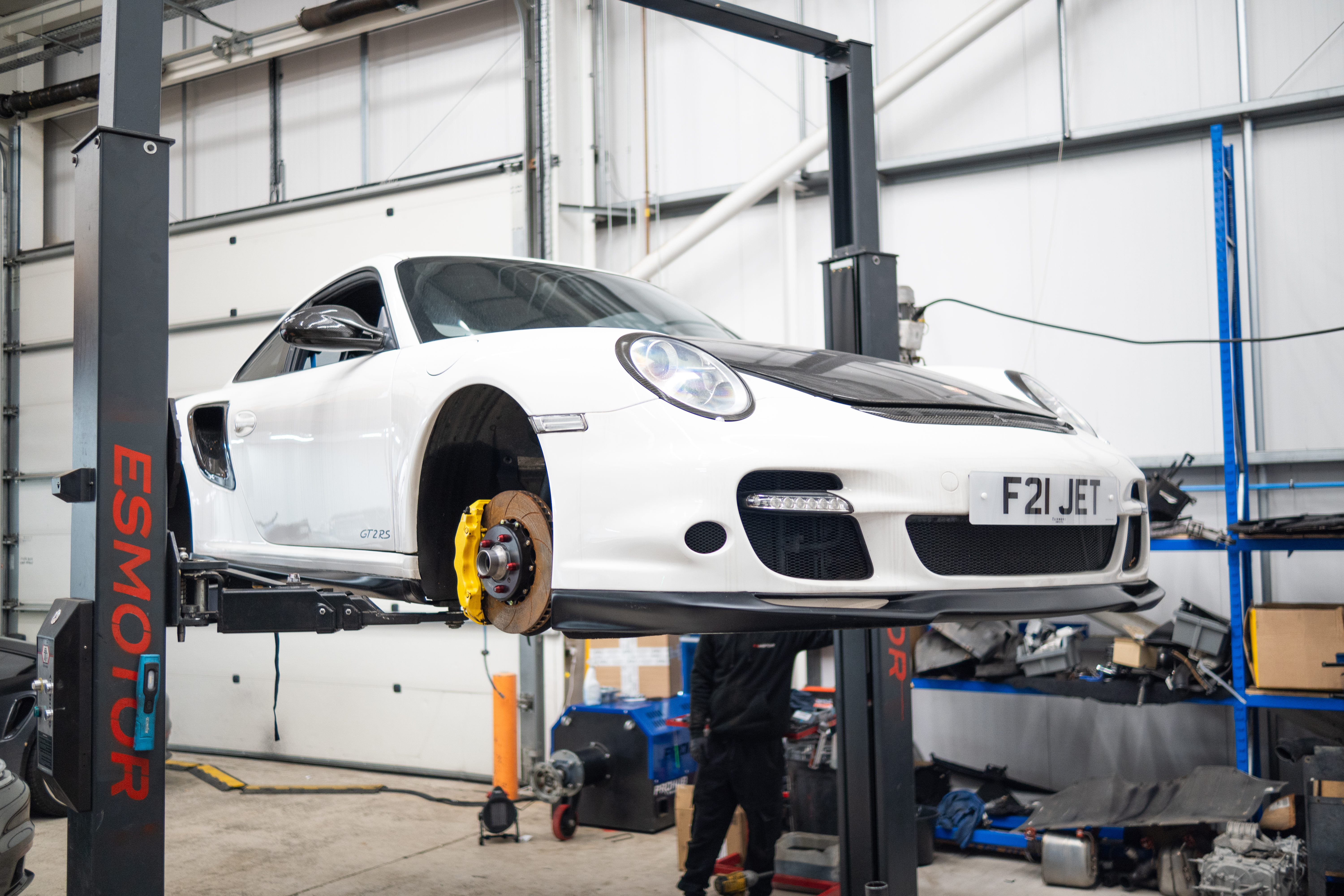 Porsche coilover inspection in workshop